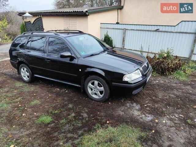 Черный Шкода Октавия, объемом двигателя 1.6 л и пробегом 204 тыс. км за 5000 $, фото 1 на Automoto.ua