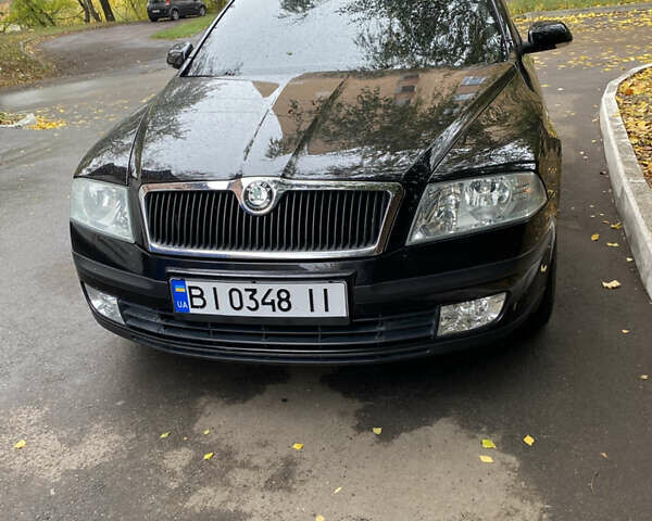 Черный Шкода Октавия, объемом двигателя 1.6 л и пробегом 211 тыс. км за 6999 $, фото 1 на Automoto.ua