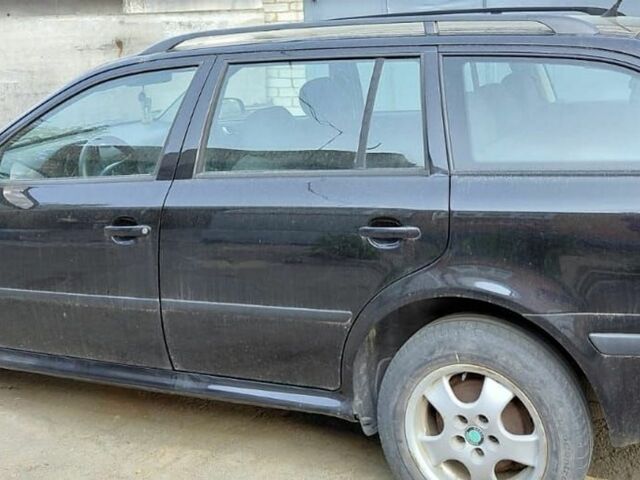Черный Шкода Октавия, объемом двигателя 1.6 л и пробегом 200 тыс. км за 5700 $, фото 1 на Automoto.ua