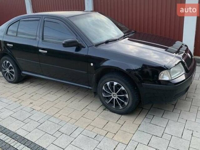 Черный Шкода Октавия, объемом двигателя 1.6 л и пробегом 304 тыс. км за 4600 $, фото 1 на Automoto.ua