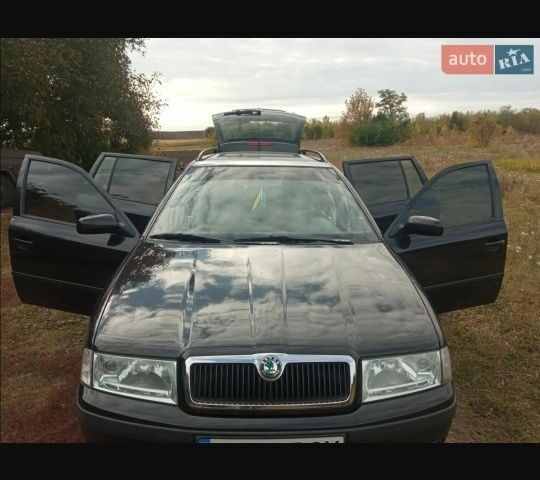 Черный Шкода Октавия, объемом двигателя 1.6 л и пробегом 155 тыс. км за 5800 $, фото 1 на Automoto.ua