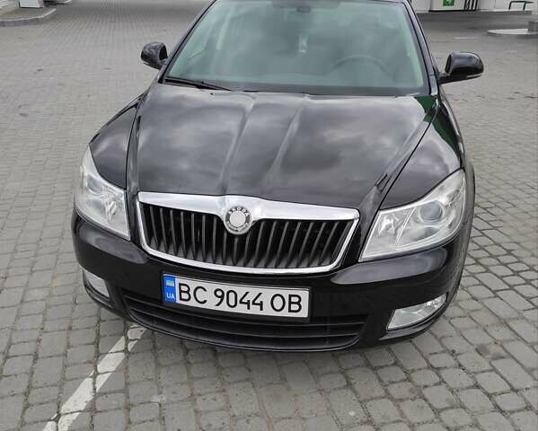 Черный Шкода Октавия, объемом двигателя 1.6 л и пробегом 205 тыс. км за 7799 $, фото 1 на Automoto.ua