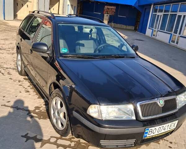 Черный Шкода Октавия, объемом двигателя 1.6 л и пробегом 202 тыс. км за 6199 $, фото 1 на Automoto.ua