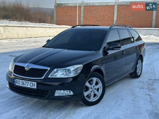 Черный Шкода Октавия, объемом двигателя 1.6 л и пробегом 265 тыс. км за 7799 $, фото 1 на Automoto.ua