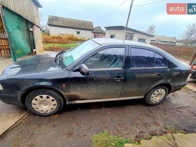 Черный Шкода Октавия, объемом двигателя 1.6 л и пробегом 300 тыс. км за 2800 $, фото 1 на Automoto.ua