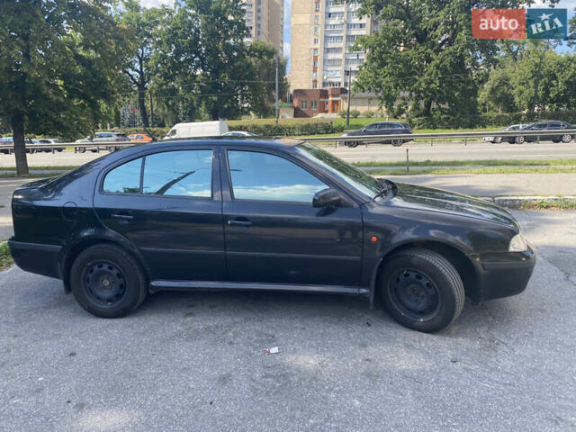 Черный Шкода Октавия, объемом двигателя 1.6 л и пробегом 250 тыс. км за 5000 $, фото 1 на Automoto.ua