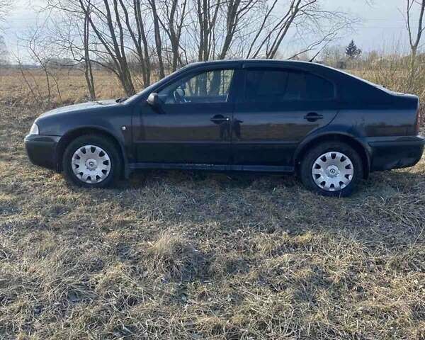 Черный Шкода Октавия, объемом двигателя 1.6 л и пробегом 230 тыс. км за 3750 $, фото 1 на Automoto.ua
