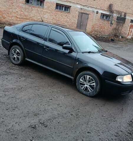 Черный Шкода Октавия, объемом двигателя 1.6 л и пробегом 175 тыс. км за 5750 $, фото 1 на Automoto.ua