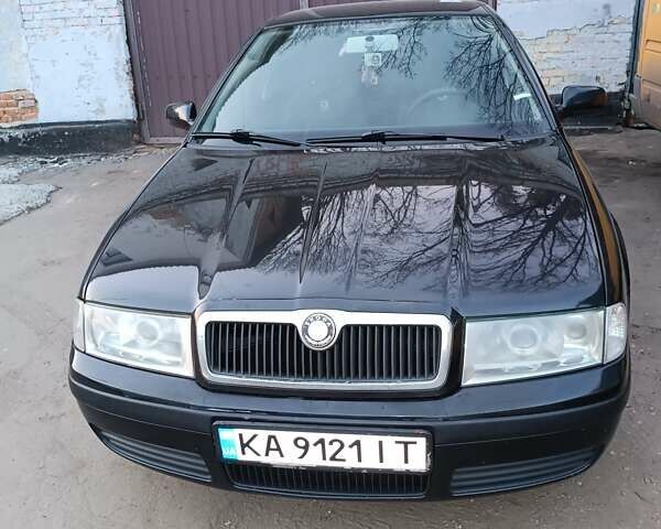 Черный Шкода Октавия, объемом двигателя 1.6 л и пробегом 431 тыс. км за 5500 $, фото 1 на Automoto.ua
