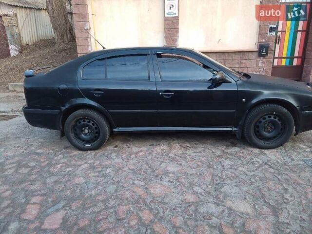 Черный Шкода Октавия, объемом двигателя 1.6 л и пробегом 252 тыс. км за 5000 $, фото 1 на Automoto.ua