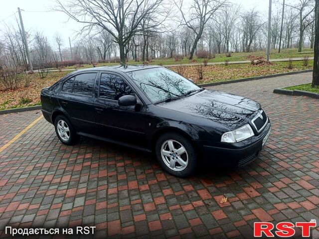 Черный Шкода Октавия, объемом двигателя 1.6 л и пробегом 239 тыс. км за 5500 $, фото 1 на Automoto.ua