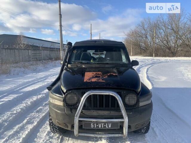 Чорний Cанг Йонг Korando, об'ємом двигуна 2.9 л та пробігом 250 тис. км за 2800 $, фото 1 на Automoto.ua