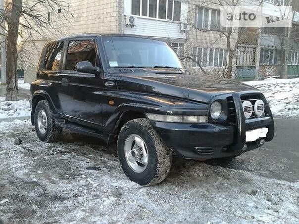 Чорний Cанг Йонг Korando, об'ємом двигуна 2.3 л та пробігом 260 тис. км за 6900 $, фото 1 на Automoto.ua