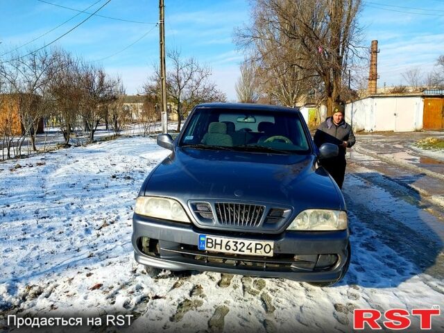 Серый Cанг Йонг Муссо, объемом двигателя 2.9 л и пробегом 11 тыс. км за 3000 $, фото 1 на Automoto.ua