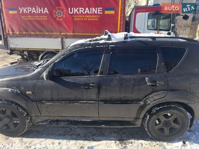 Черный Cанг Йонг Рекстон, объемом двигателя 2.7 л и пробегом 300 тыс. км за 4500 $, фото 1 на Automoto.ua