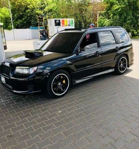 Черный Субару Форестер, объемом двигателя 2.46 л и пробегом 97 тыс. км за 12000 $, фото 1 на Automoto.ua