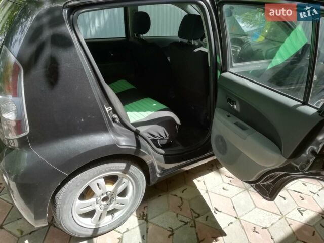 Чорний Субару Джасті, об'ємом двигуна 1 л та пробігом 180 тис. км за 4700 $, фото 1 на Automoto.ua