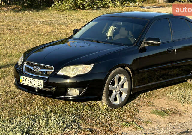 Черный Субару Легаси, объемом двигателя 1.99 л и пробегом 272 тыс. км за 5300 $, фото 1 на Automoto.ua