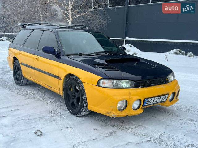 Желтый Субару Легаси, объемом двигателя 2.46 л и пробегом 200 тыс. км за 2500 $, фото 1 на Automoto.ua