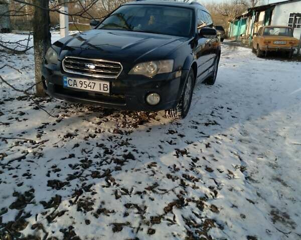 Черный Субару Аутбек, объемом двигателя 2.46 л и пробегом 316 тыс. км за 5600 $, фото 1 на Automoto.ua