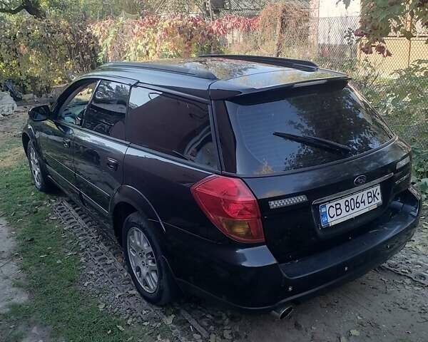 Черный Субару Legacy Outback, объемом двигателя 2.46 л и пробегом 244 тыс. км за 5000 $, фото 1 на Automoto.ua