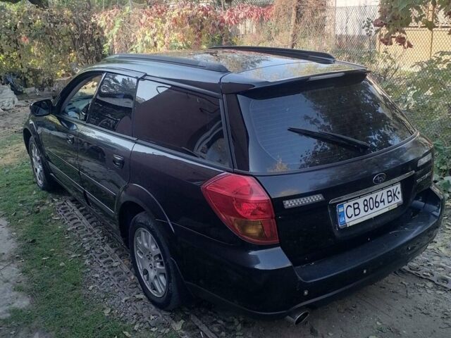 Черный Субару Legacy Outback, объемом двигателя 2.46 л и пробегом 244 тыс. км за 5000 $, фото 1 на Automoto.ua