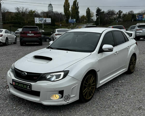 Субару WRX STI 2014 в Белой Церкве на Automoto.ua Белый Субару WRX STI, объемом двигателя 2.46 л и пробегом 68 тыс. км за 18500 $, фото 1 на Automoto.ua