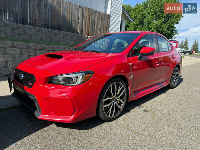 Красный Субару WRX STI, объемом двигателя 2.5 л и пробегом 110 тыс. км за 30000 $, фото 1 на Automoto.ua