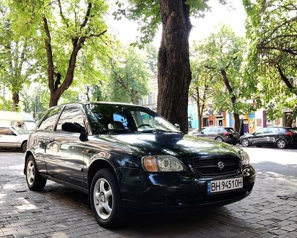 Черный Сузуки Балеро, объемом двигателя 1.3 л и пробегом 332 тыс. км за 2800 $, фото 1 на Automoto.ua