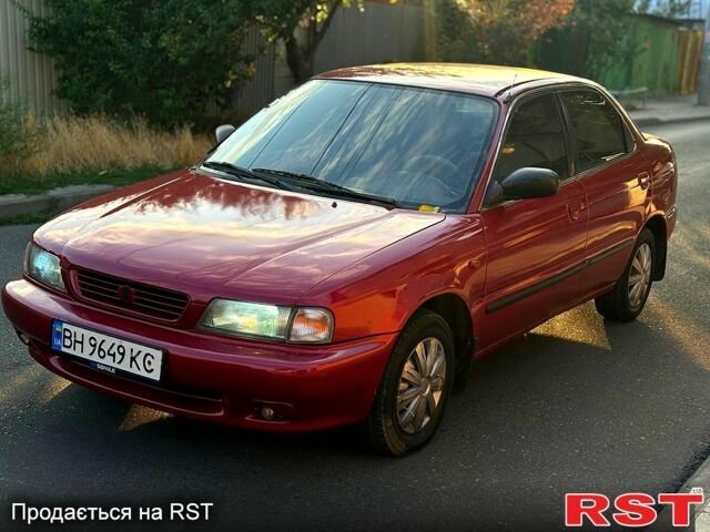 Красный Сузуки Балеро, объемом двигателя 1.6 л и пробегом 200 тыс. км за 2100 $, фото 1 на Automoto.ua