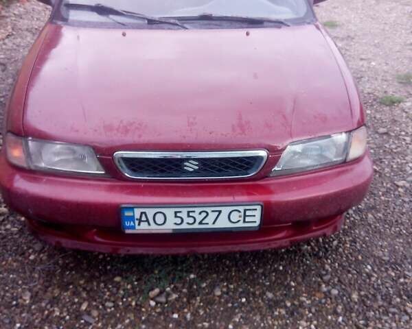 Красный Сузуки Балеро, объемом двигателя 1.3 л и пробегом 174 тыс. км за 1550 $, фото 1 на Automoto.ua