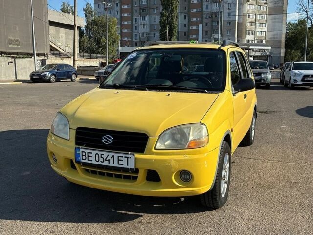 Желтый Сузуки Игнис, объемом двигателя 1.33 л и пробегом 167 тыс. км за 3500 $, фото 1 на Automoto.ua