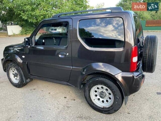 Коричневый Сузуки Джимни, объемом двигателя 1.3 л и пробегом 110 тыс. км за 16000 $, фото 1 на Automoto.ua