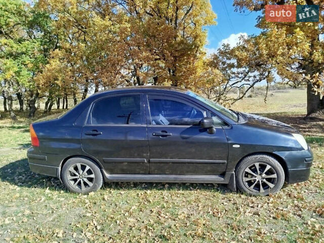 Черный Сузуки Лиана, объемом двигателя 1.6 л и пробегом 300 тыс. км за 3900 $, фото 1 на Automoto.ua