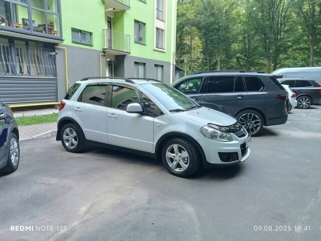 Белый Сузуки СХ4, объемом двигателя 1.6 л и пробегом 125 тыс. км за 9400 $, фото 1 на Automoto.ua