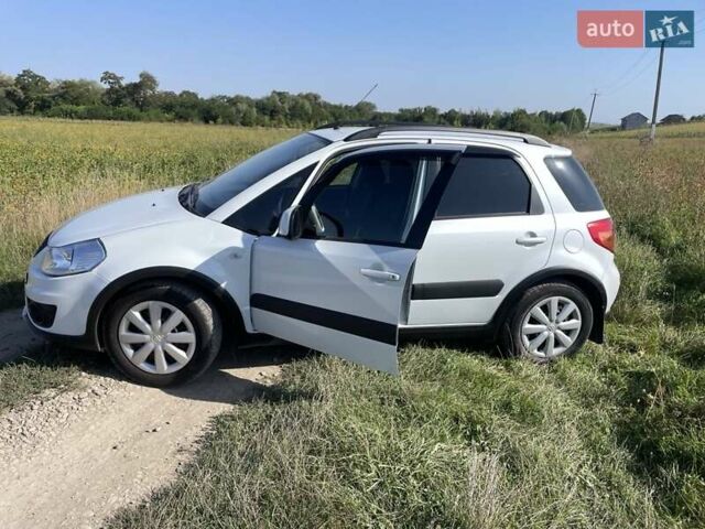 Белый Сузуки СХ4, объемом двигателя 1.59 л и пробегом 123 тыс. км за 10000 $, фото 1 на Automoto.ua
