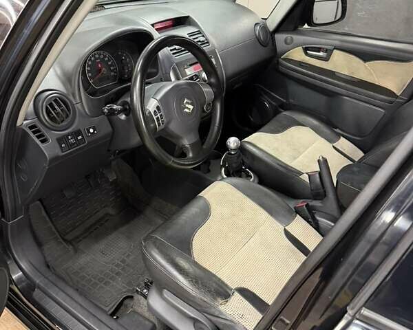 Черный Сузуки СХ4, объемом двигателя 1.6 л и пробегом 310 тыс. км за 4700 $, фото 1 на Automoto.ua