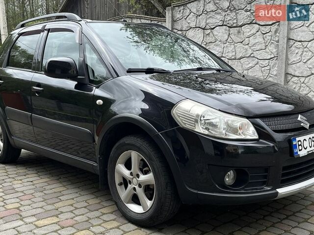 Черный Сузуки СХ4, объемом двигателя 1.6 л и пробегом 214 тыс. км за 5750 $, фото 1 на Automoto.ua