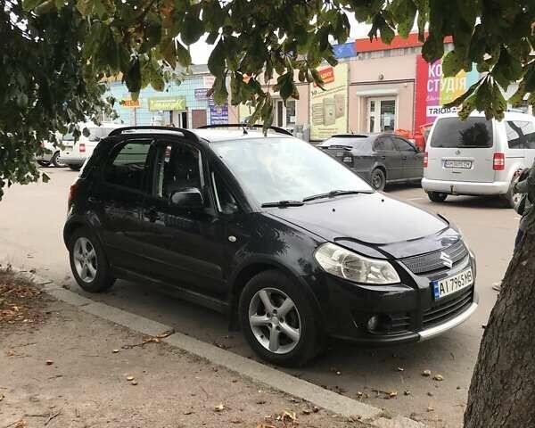 Черный Сузуки СХ4, объемом двигателя 1.59 л и пробегом 185 тыс. км за 6599 $, фото 1 на Automoto.ua