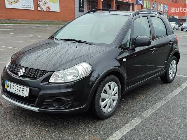 Черный Сузуки СХ4, объемом двигателя 1.6 л и пробегом 82 тыс. км за 11500 $, фото 1 на Automoto.ua