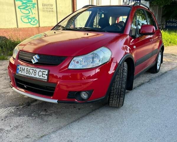 Красный Сузуки СХ4, объемом двигателя 1.6 л и пробегом 233 тыс. км за 5300 $, фото 1 на Automoto.ua
