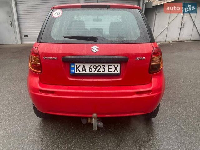Красный Сузуки СХ4, объемом двигателя 1.59 л и пробегом 250 тыс. км за 5500 $, фото 1 на Automoto.ua