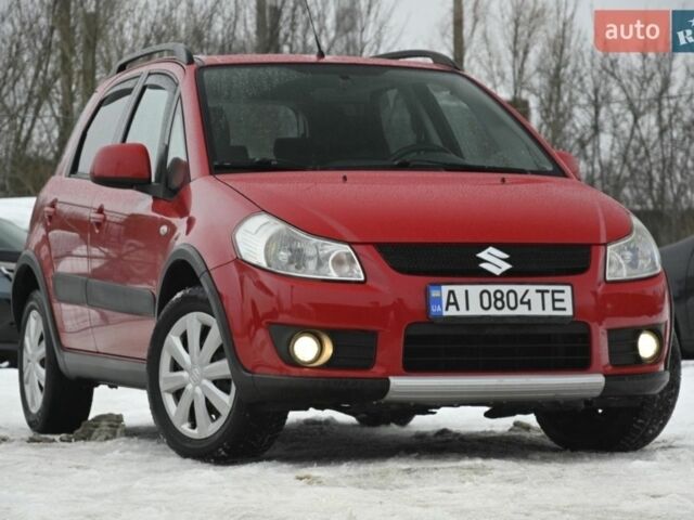 Красный Сузуки СХ4, объемом двигателя 1.6 л и пробегом 283 тыс. км за 5600 $, фото 1 на Automoto.ua