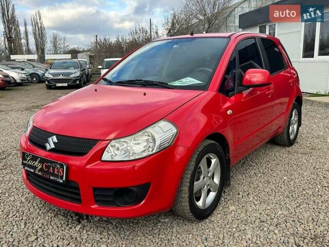 Красный Сузуки СХ4, объемом двигателя 1.6 л и пробегом 183 тыс. км за 6500 $, фото 1 на Automoto.ua
