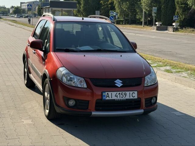 Красный Сузуки СХ4, объемом двигателя 1.6 л и пробегом 203 тыс. км за 6925 $, фото 1 на Automoto.ua