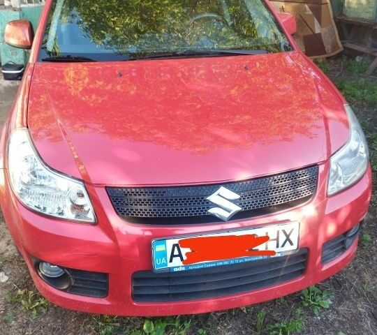 Красный Сузуки СХ4, объемом двигателя 1.6 л и пробегом 230 тыс. км за 6300 $, фото 1 на Automoto.ua