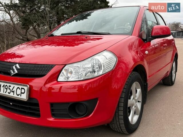 Красный Сузуки СХ4, объемом двигателя 1.59 л и пробегом 94 тыс. км за 6499 $, фото 1 на Automoto.ua