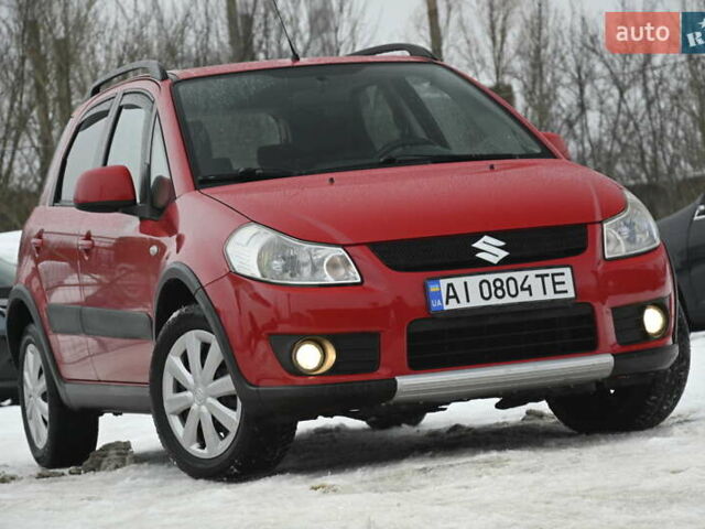 Красный Сузуки СХ4, объемом двигателя 1.6 л и пробегом 283 тыс. км за 5700 $, фото 1 на Automoto.ua