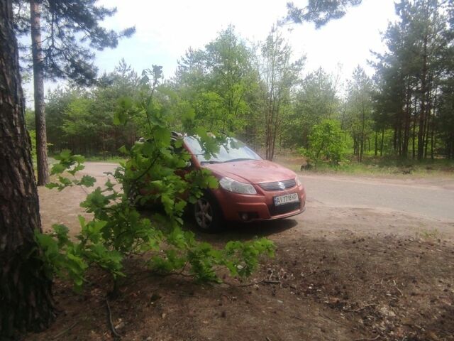Красный Сузуки СХ4, объемом двигателя 1.6 л и пробегом 230 тыс. км за 5450 $, фото 1 на Automoto.ua