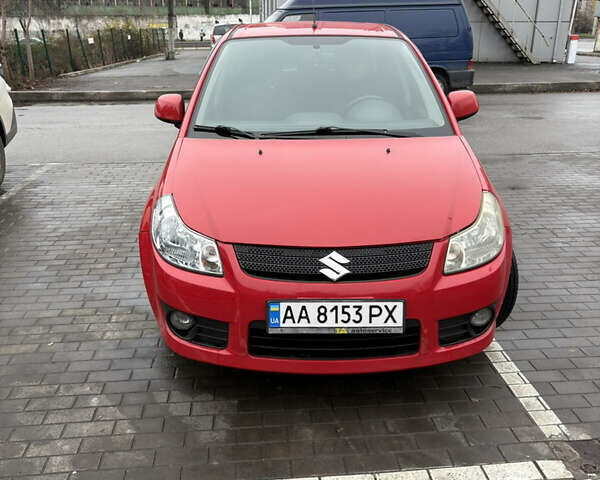 Красный Сузуки СХ4, объемом двигателя 1.59 л и пробегом 200 тыс. км за 5500 $, фото 1 на Automoto.ua